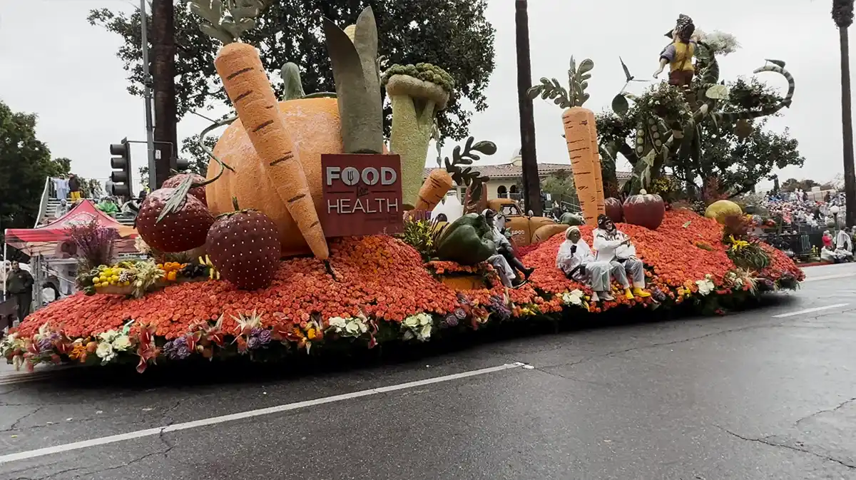 rose-parade-2026-09 Rose Parade 2026 floats moving through torrential rain in Pasadena