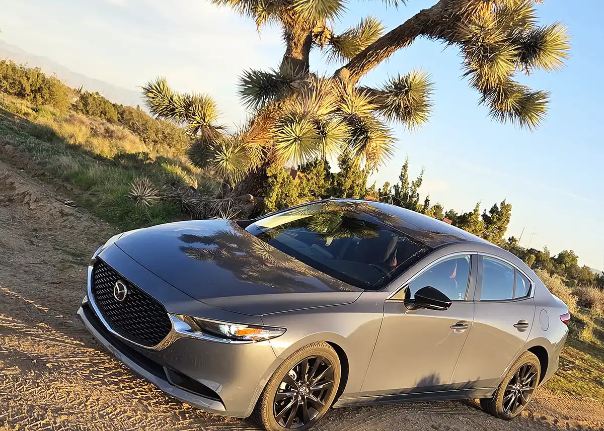 Mazda3 sedan review highlighting premium design, driving joy, and near-luxury interior value
