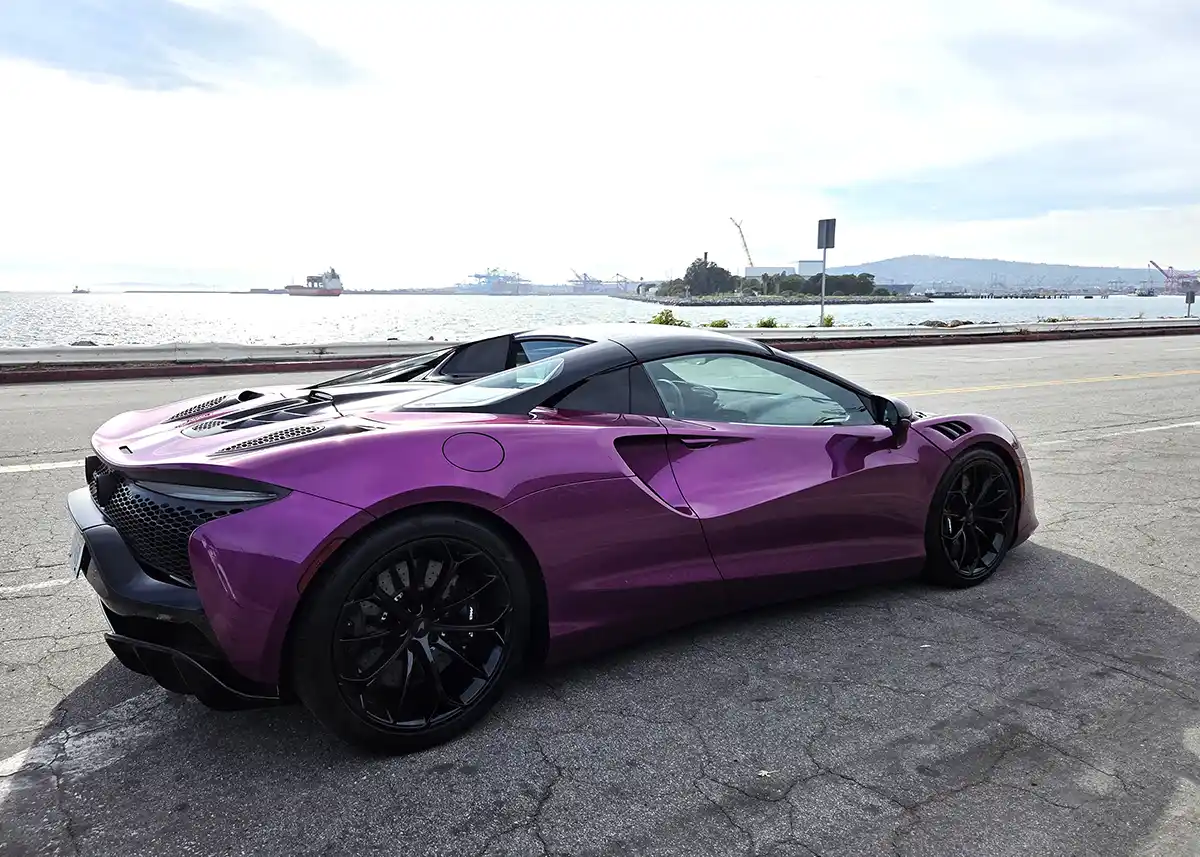 2026 McLaren Artura Spider in motion on a road