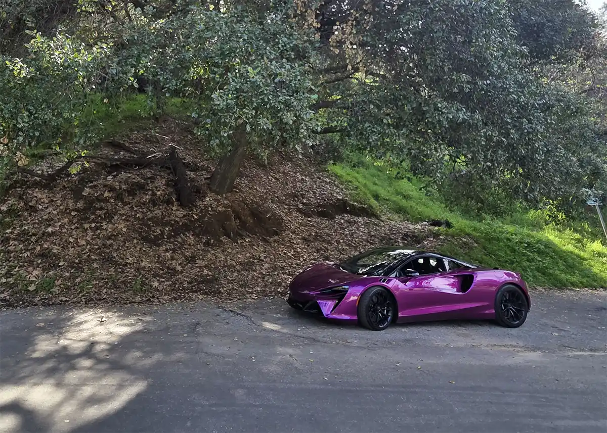 2026 McLaren Artura Spider in motion on a road